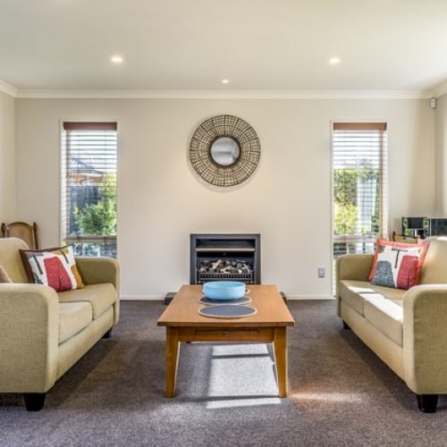 living-room-modern-apartment-with-two-identical-sofas-opposite-each-other_181624-14768